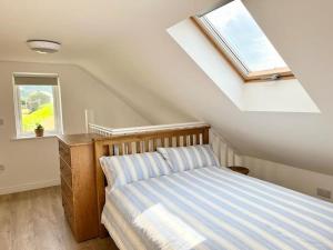 Voodi või voodid majutusasutuse Muckish Maison toas
