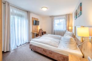Postel nebo postele na pokoji v ubytování Hotel Schaider
