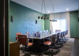 a conference room with a long table and chairs at The Blake Hotel in New Haven