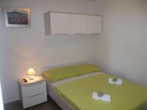 Кровать или кровати в номере Apartment Vrančić