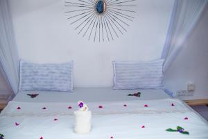 Łóżko lub łóżka w pokoju w obiekcie Babalao Rooftop Hotel