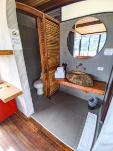 a bathroom with a sink and a toilet at Summer C in Macanal