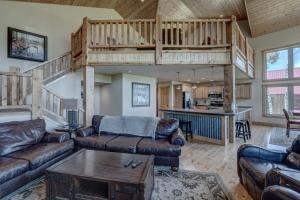 a living room with couches and a loft at Holy Terror Chalet At Terry Peak Ski Resort in Lead