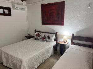 Postel nebo postele na pokoji v ubytování Pousada Estalagem Paraty