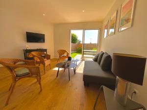 a living room with a couch and a table at Charmant studio Pornicais in Pornic