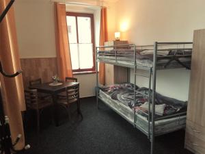 Postel nebo postele na pokoji v ubytování Nocleh U Kapličky