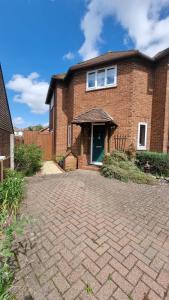a brick house with a brick driveway in front of it at Glebe House, Private entrance, free parking on drive, Self check in, Netflix in Ashford