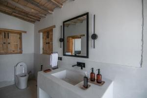 a bathroom with a sink and a toilet at BROQ in Skardu