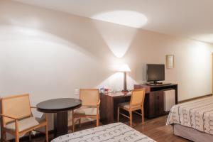 A bed or beds in a room at DELPLAZA Excelsior São Paulo - By Monreale