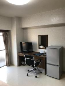 an office with a desk with a computer and a chair at City Inn Kokura - Vacation STAY 12140 in Kitakyushu