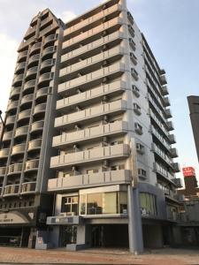 a tall building with a pole in front of it at City Inn Kokura - Vacation STAY 12140 in Kitakyushu