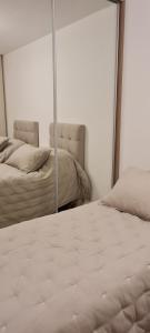 Ein Bett oder Betten in einem Zimmer der Unterkunft Pilar de la Patagonia - Frente al Mar Erossion