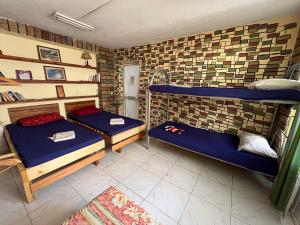 Postel nebo postele na pokoji v ubytování Milingona City Center Hostel