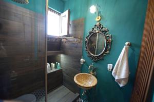 a bathroom with a sink and a mirror at AMALFI luxury APARTMENT in Komotini