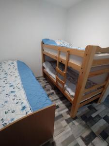 a pair of bunk beds in a room at Kuća za odmor Drina in Zvornik