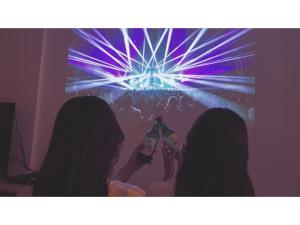 two women are standing in front of a video game at ESLEAD HOTEL Namba Daikokucho - Vacation STAY 86025v in Osaka