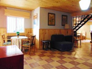 a living room with a couch and a table at Casa en la sierra de Madrid para grupos grandes in Madrid