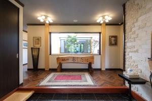 a living room with a bench and a window at Villa Ashitani - Vacation STAY 08864v in Nantan city