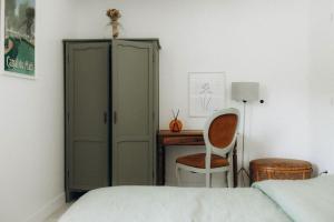 Cama o camas de una habitación en Gîtes Chaleureux écoresponsable
