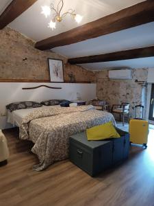 a bedroom with a bed and a table and chairs at La Stella in Civita