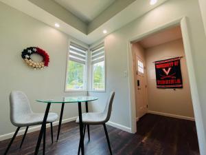 a dining room with a table and two chairs at Sonsak - Unit 4 in Charlottesville