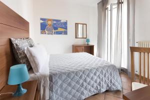 A bed or beds in a room at Residence Del Sole