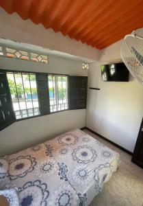 เตียงในห้องที่ Hotel Los Balcones