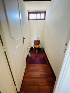 a small bathroom with a toilet in a room at Le Mas aux Papillons in Vendat