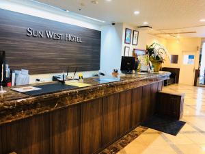 a sun west hotel lobby with a bar at Sunwest Hotel Sasebo - Vacation STAY 22075v in Sasebo