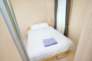 Uma cama ou camas num quarto em FL Rejidence Shinjuku 2 - Vacation STAY 15197