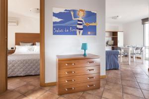 A bed or beds in a room at Residence Del Sole
