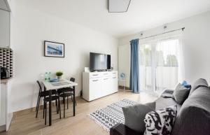 Televízia a/alebo spoločenská miestnosť v ubytovaní Praga Bliska Comfort Studio