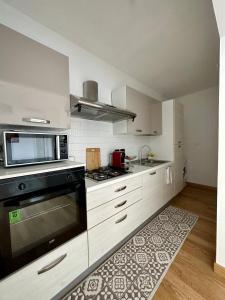 A kitchen or kitchenette at Due Passi dal Porto