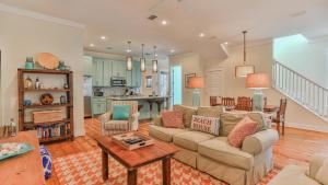 a living room with a couch and a table at Family Ties - Located in Seacrest Beach 2 Master bedrooms and a large communal pool in Rosemary Beach