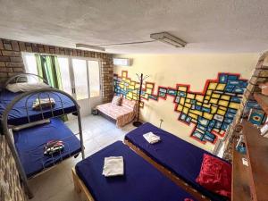 Postel nebo postele na pokoji v ubytování Milingona City Center Hostel