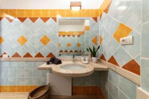 a bathroom with a sink and a mirror at Sweet Life in Golf Is Molas in Pula +34 photos