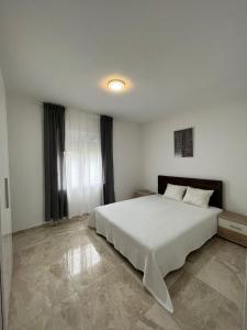 Ein Bett oder Betten in einem Zimmer der Unterkunft TWINS Apartments