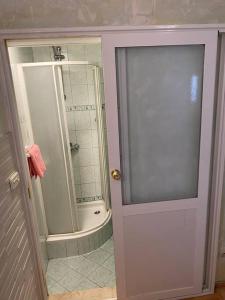 a bathroom with a shower and a glass door at Villa Kolorina in Dubrovnik +21 photos