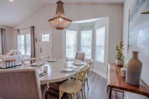 a dining room with a table and chairs at Ocean Antics - Close to the Beach and minutes to Seaside along 30A in Santa Rosa Beach