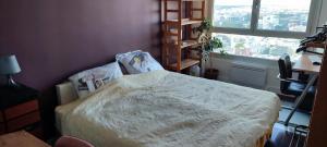Una cama o camas en una habitación de Full apt - Top floor - Eiffel Tower Panoramic View
