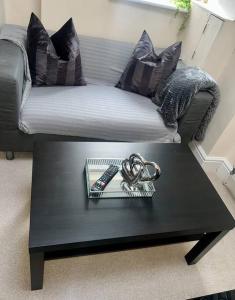 a black coffee table in a living room with a couch at 2 Bedroom Apartment with Balcony in Oxford