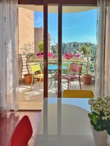 a table and chairs on a balcony with a view at Rome Suite Talenti in Rome