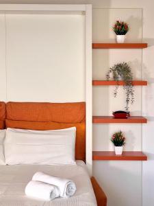 a bedroom with a bed with wooden shelves at Rome Suite Talenti in Rome