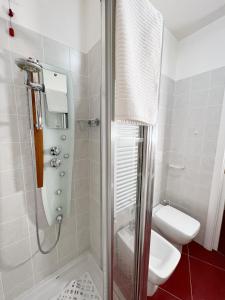 a bathroom with a shower and a toilet and a sink at Rome Suite Talenti in Rome