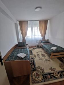 Uma cama ou camas num quarto em Apartman Monaco