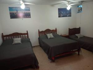 Casa Privada con alberca tesisinde bir odada yatak veya yataklar