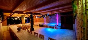 a room with a table and chairs and lights at Casa Simion in Sibiu