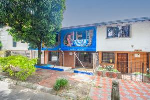 a building with a mural on the side of it at Blue Coast Hostal in Medellín