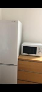 a white microwave sitting on top of a counter at W13 x Weekly Monthly Discount in London
