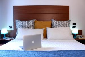 A bed or beds in a room at Residence Del Sole